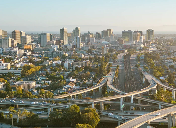 Aerial view of Oakland, California, showing highways and buildings.