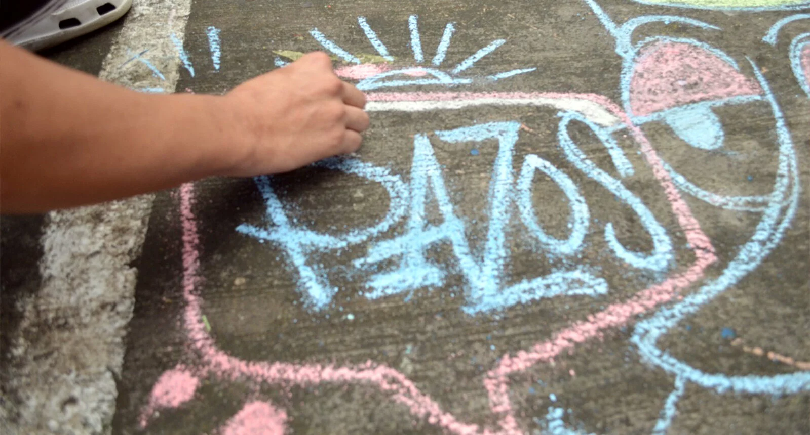 Pazos written in chalk on the sidewalk