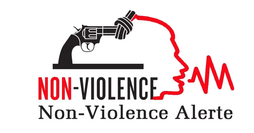 Logo for Non-violence Alerte with an image of a black and white broken gun that leads into an outline of a face speaking.
